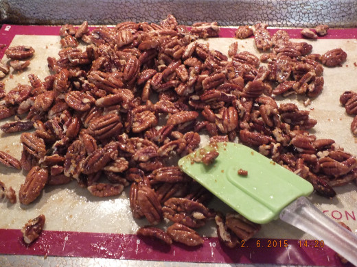 Let the pecans completely cool and then use a rubber or silicone spatula to break up the pecans.