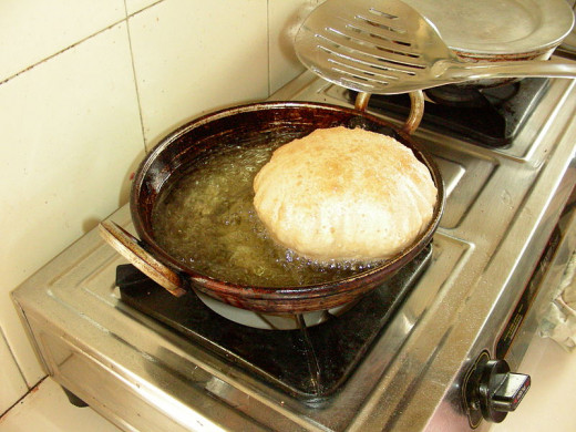 Frying a plain poori