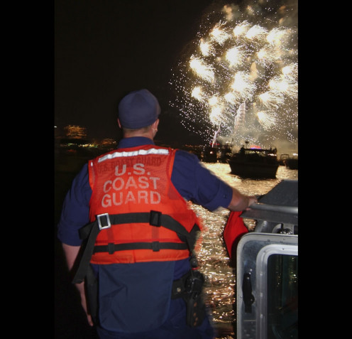 U.S. Coast Guard keeps a sharp eye on a fireworks display to make sure things go as planned.