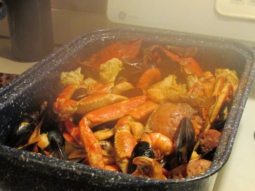 A delicious seafood combination of crab legs, shrimp, mussels, clams and corn on the cob was served.