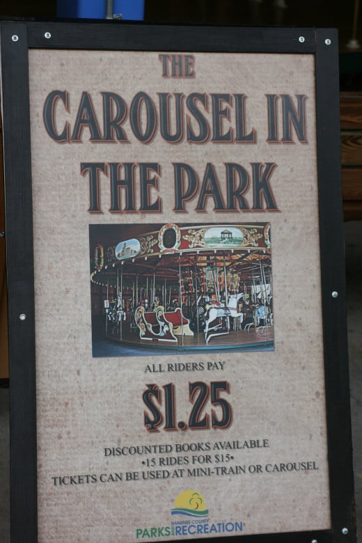 Sign for the Carousel in the Park