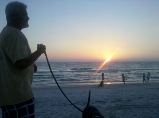 A good father spending time with his family on the beach