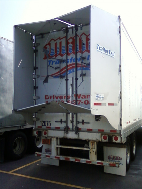 Opening those trailer tail panels up before driving to save on fuel cost.