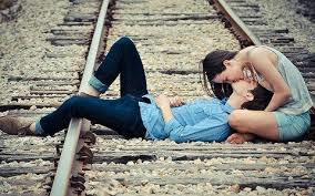 What an ignorant man. Laying on a railroad track to show his macho attitude to get the girl to kiss him.