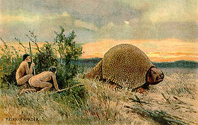 Paleo Indians hunting a large glyptodon