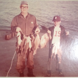 Steve and (who IS that little boy) with a nice string of White Bass.