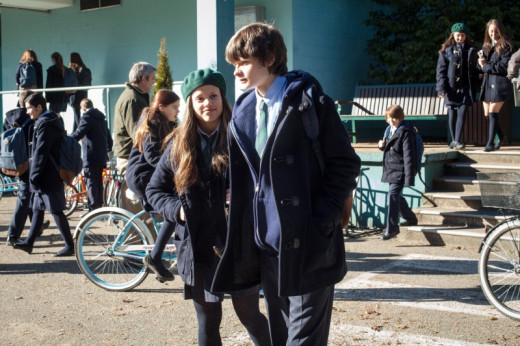 Ben and Amy walking out of the school
