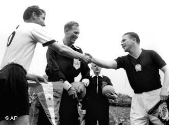 Fritz Walter (left) and Ferenc Puskás (right) shake hands before the final of the 1954 World Cup