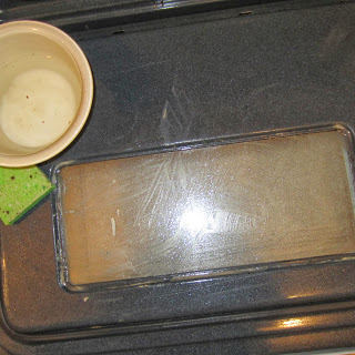 A mixture of baking soda, water and vinegar removed the grease. I allowed the solution to sit for a few moments longer once it has been applied.