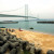 View of Akashi Bridge from beach on Awaji Island Hyogo Japan