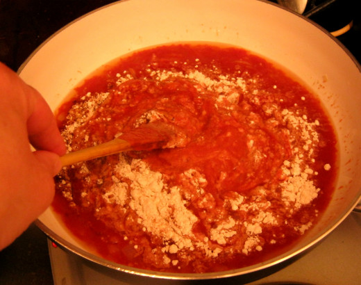 Stirring in the flour, salt, pepper, paprika and ground ginger.