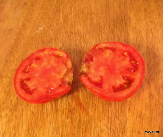 My tomato is not very appetizing.  It's going in the trash can! 