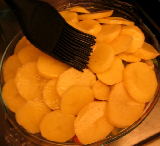 Brushing with melted fat.