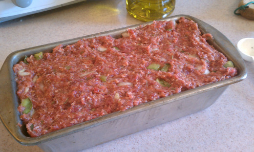 Now pat your giant meatball into a loaf pan.