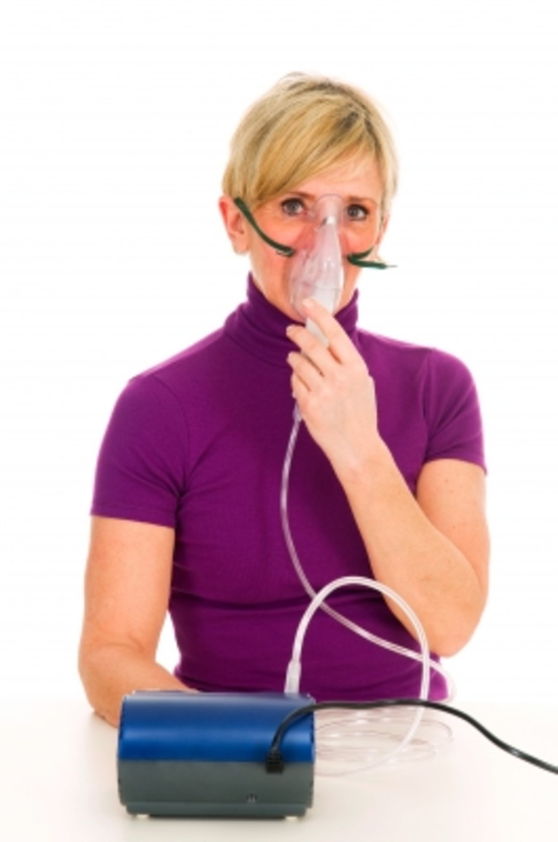 Woman with a nebulizer mask. Older nebulizers have always been electric and tended to keep one close to home. Today portable battered powered nebulizers can give asthma sufferers  freedom to come and go, taking their portable nebulizers with them