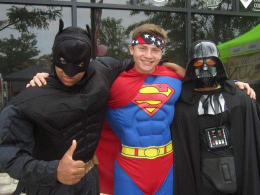 Batman, Superman, and Darth Vader all come together peacefully to celebrate summer with Downtown Auburn Hills!