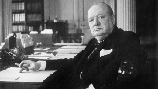 A relaxed Winston Churchill at his desk, cigar in hand: '...'We shall have to get the body back...' He was prepared to go the whole hog again if needed..