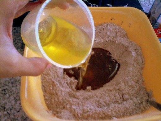 Pour in the cooking oil and vanilla extract
