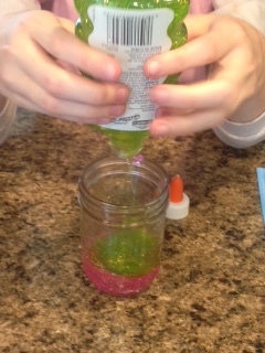 Add your glitter glue - we chose green and pink