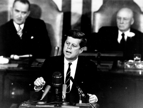 President John F. Kennedy speaking before the US Congress. V.P. Lyndon Johnson is on the upper left.