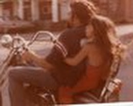 Here I am on the back of my dad's harley-davidson motocycle.