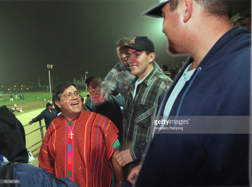 Pastor Isaac Canales of Misson Ebenezar Family Church attends a youth football game at Torrance High.