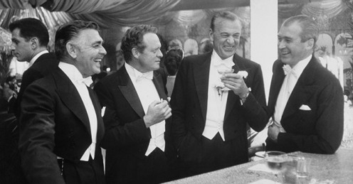 Hollywood Elite: Gregory Peck and his buddies at a cocktail party.