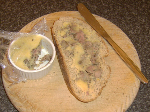Spreading the chicken liver pate on the hot toast
