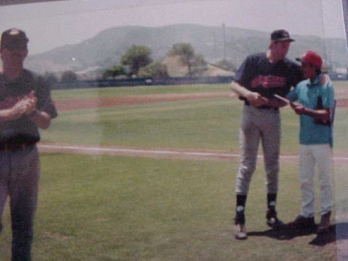 Here's J. R. Caviness, my manager, presenting the MVP Award of the National Adult Baseball Association Ventura County All-Star game in '96. I was winning pitcher. You could see my 6' 6" height as opposed to J. R. at 5' 6"