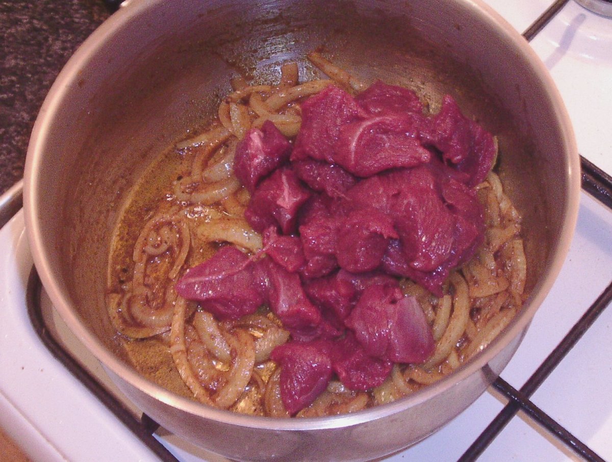 Diced kangaroo leg meat is added to spiced onions
