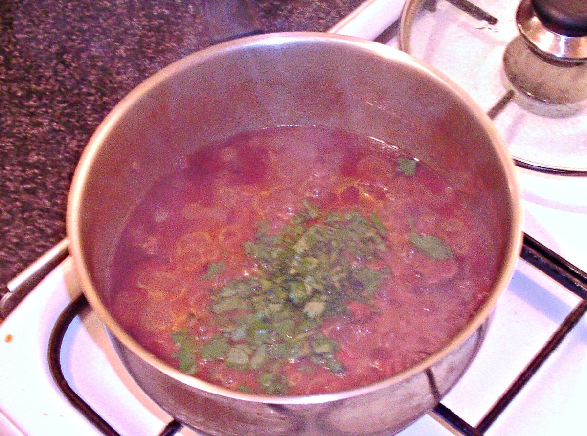 Chopped coriander/cilantro is added to kangaroo curry