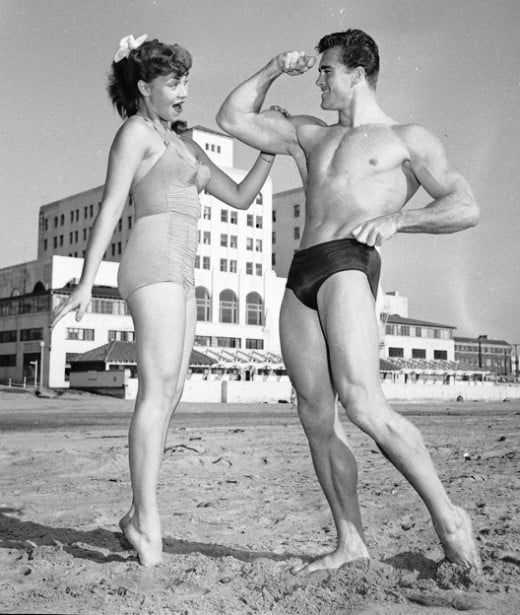 Ed Holovchik [aka Ed Fury], bodybuilder and Mr. Los Angeles contestant with model Jackie Coey, 1953