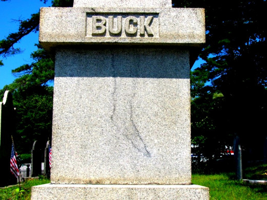 Image of what looks like a foot stained on Jonathan Buck's tombstone.  The stone has been replaced several times, but the stain returns each time.