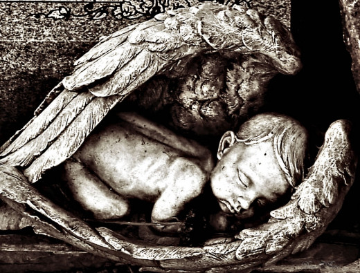 Baby cradled in angel's wings