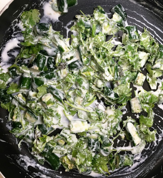 Add yogurt, coriander leaves, mint leaves and green chilis.