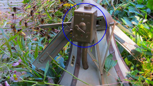 On & off control of pond pump (circled) is built into windmill.