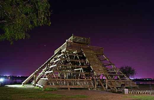 Sculpture/carving of Indigenous pyramid in the park.