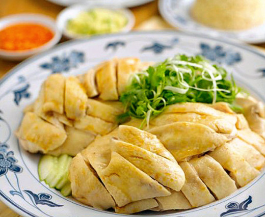 Usually when you have more than one person and want to share, the chicken (usually half or a whole chicken) is chopped on a communal plate.