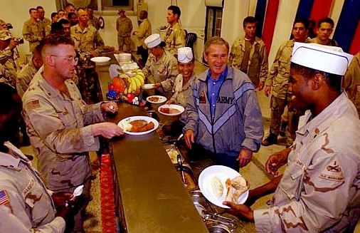 Former US President George W. Bush celebrating Thanksgiving with American soldiers in Iraq in November 2003.