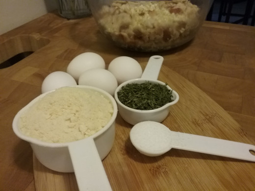 Here we have a cup of grated Parmesan-Romano cheese, 1/3 cup of dried parsley (or you could always use fresh chopped parsley--I just happened to have this on hand), a tablespoon of coarse salt, and four eggs.