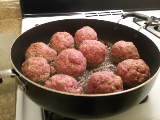 Add the meatballs to the hot oil. Leave space between each one. 
