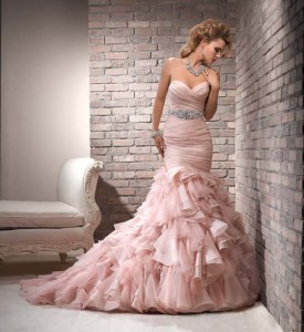 Pink is nice idea for a wedding dress. Something outside is of the box for a offbeat and nontraditional ride.