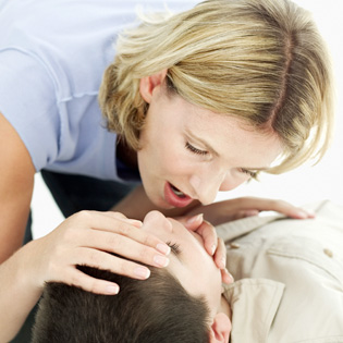 Woman performing CPR on a child. Photo courtesy of funfirstaid.ca