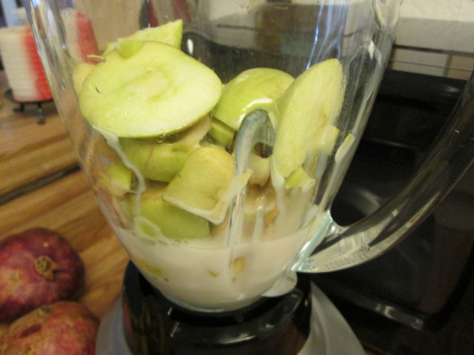 Add almond milk to the blender to puree the apples.
