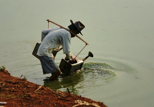 Gallons of lake water were carried on his shoulder to water his field before planting. 
