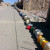 A Long Queue of Empty Water Cans and Bowls
