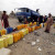 A Long Queue of Empty Water Jerrycans