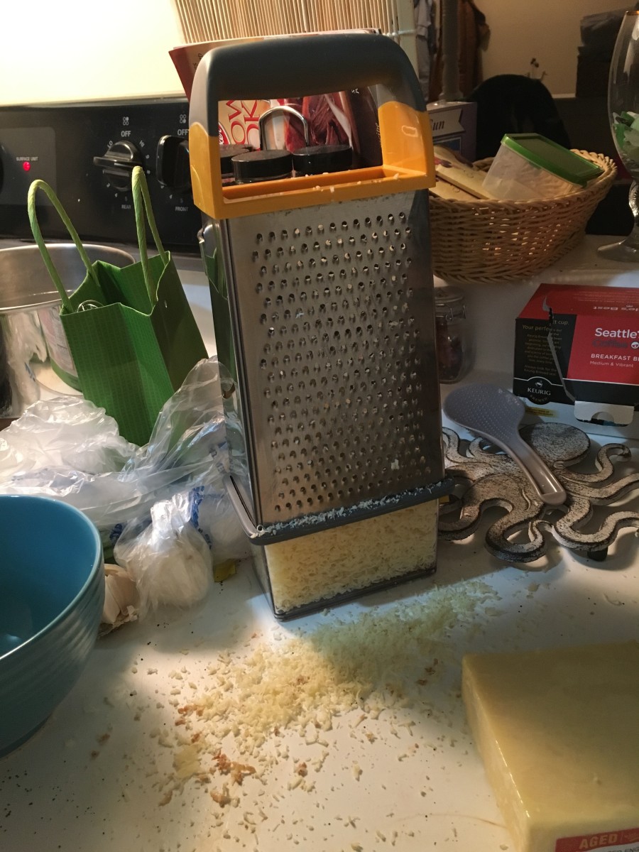There is a lot of cheese to grate, so if you have someone that would like to help out in the kitchen it will save you a lot of time to have them grate the cheese.