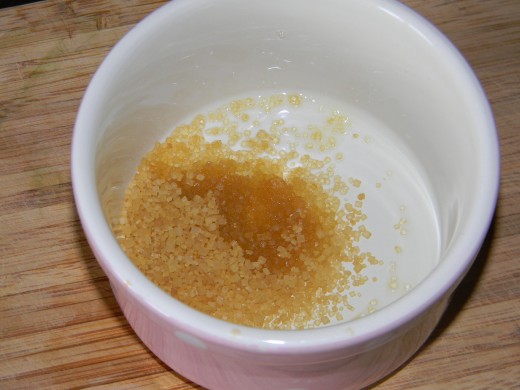 Next add the Sweet Almond Oil into the bowl with the sugar.