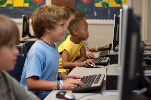 Students learning computer. 